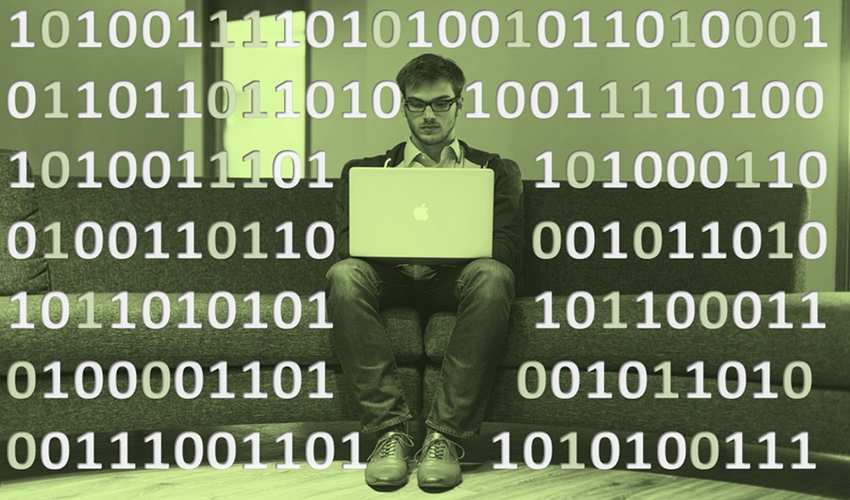 man at laptop with binary code floating around him