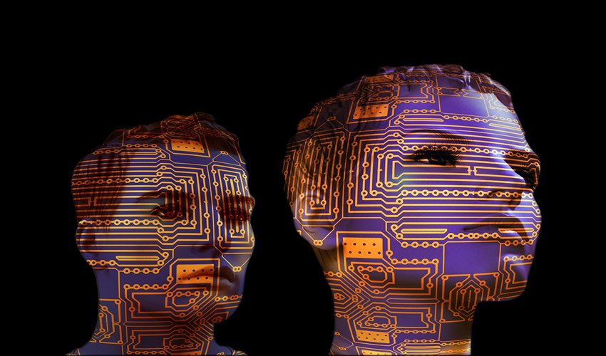 image of human head profiiles overlaid with circuit boards