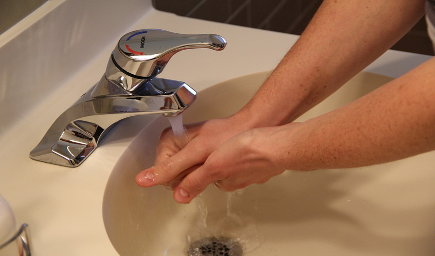 washing hands at sink
