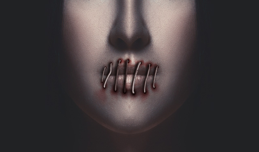 image of face with lips sewn shut