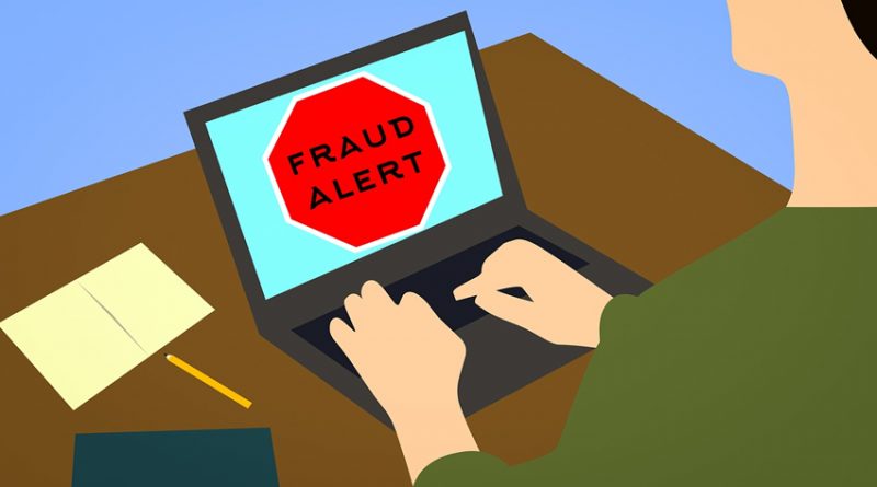 laptop screen saying 'fraud alert'