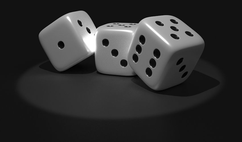 Three dice against a black background