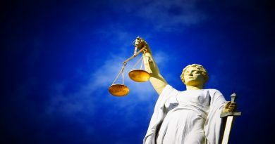 scales of justice against blue sky