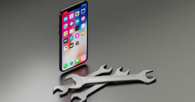 iPhone X next to some spanners